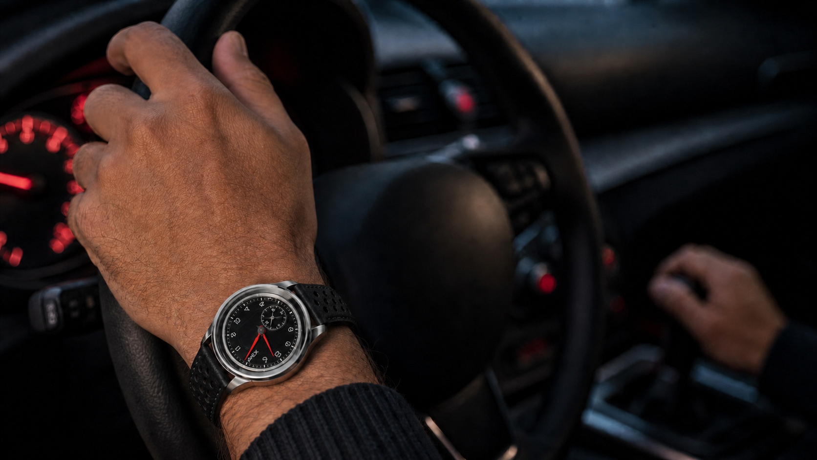 Driver wearing the Apex watch with one hand on the wheel